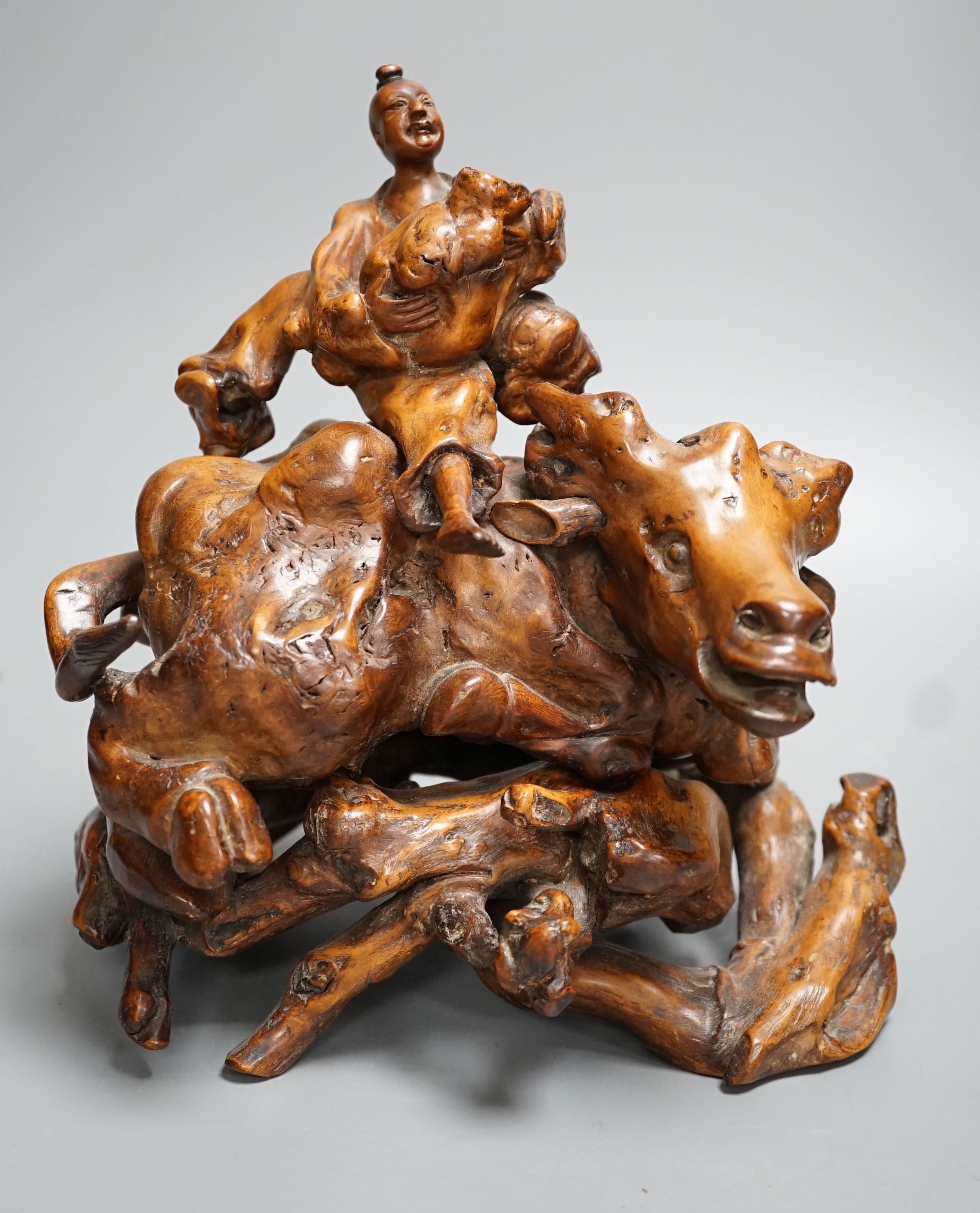 An 18th / 19th century Chinese rootwood figure of a boy on a buffalo 24cm